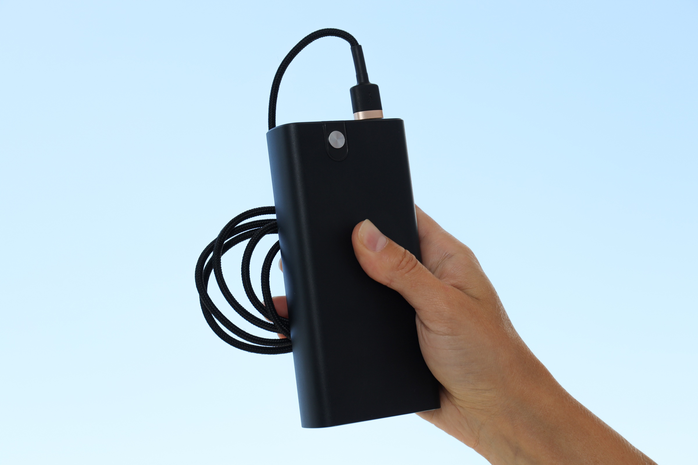A power bank and cable being checked before a journey