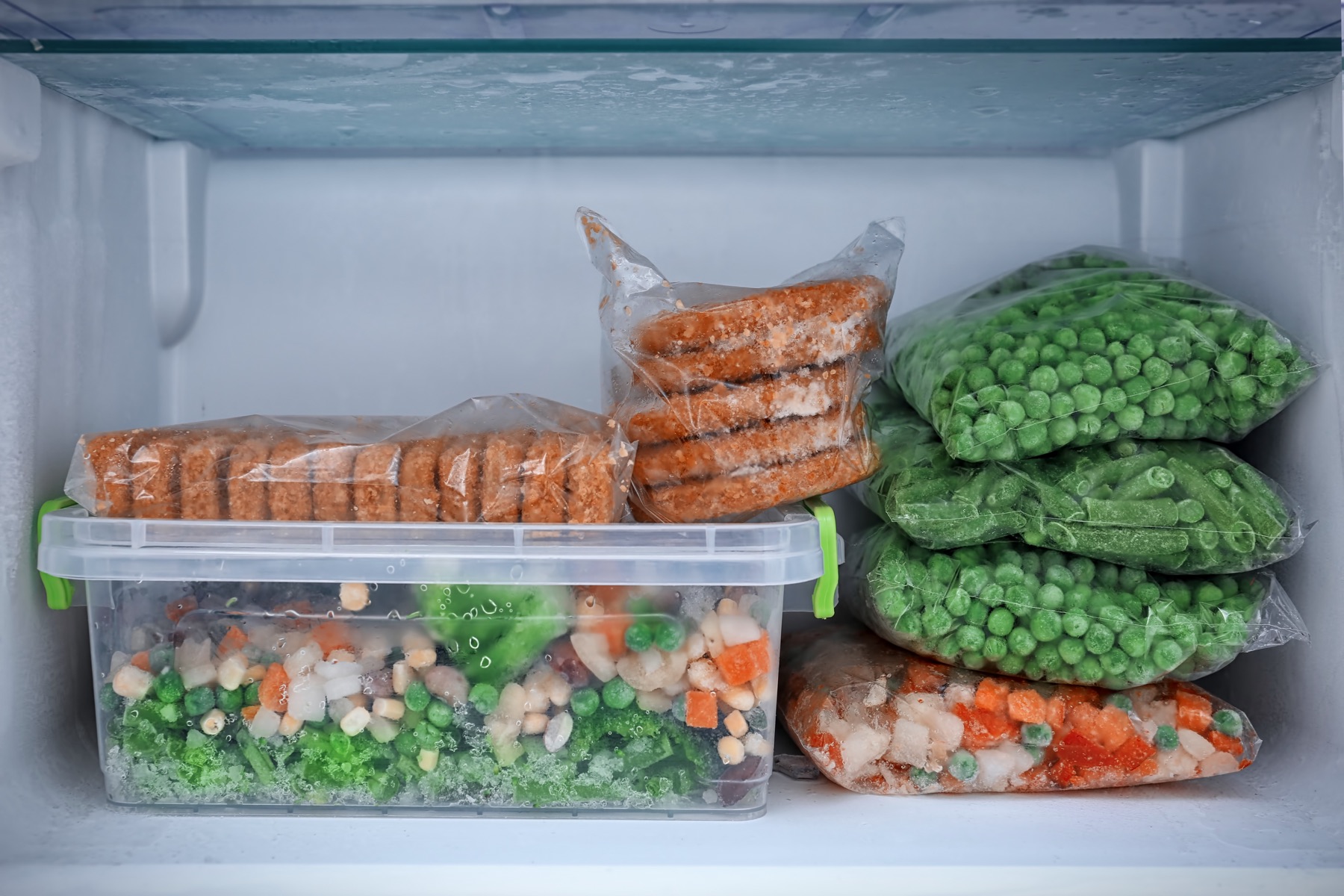 Frozen vegetables and food stored inside a freezer