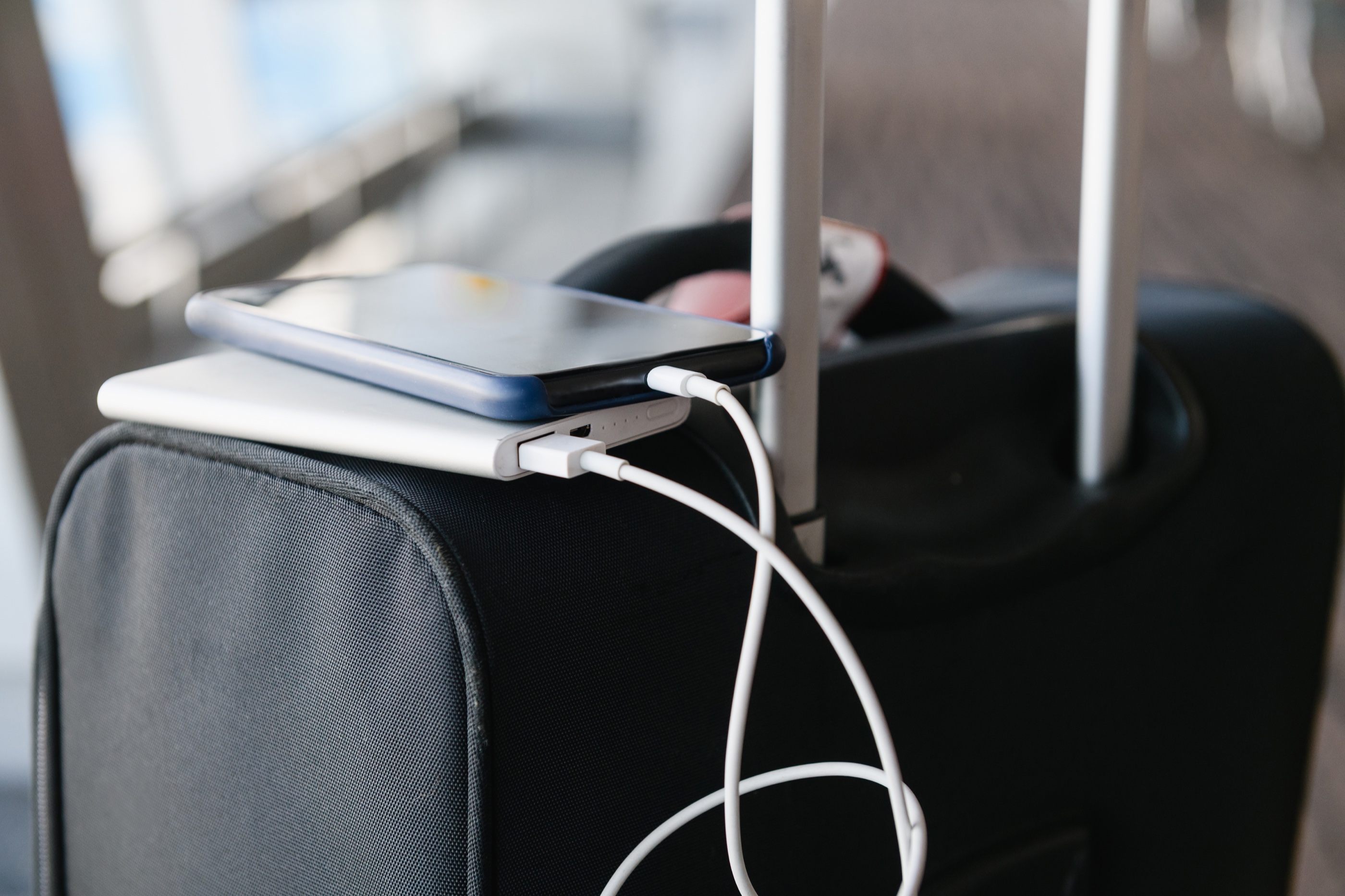 A phone being charged on the go with a power bank