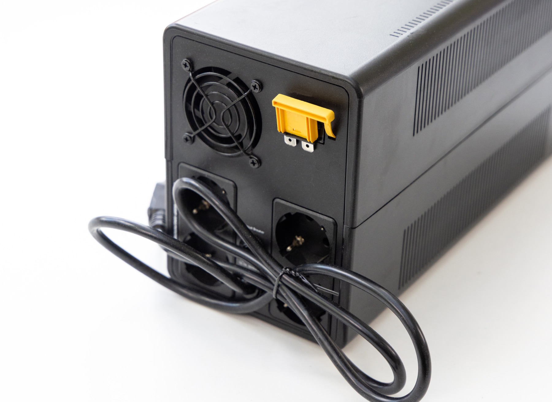 Rear view of a generic UPS showing that battery-backed and surge-only outlets must be identified